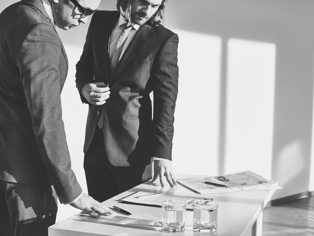 Two business people reviewing documents
