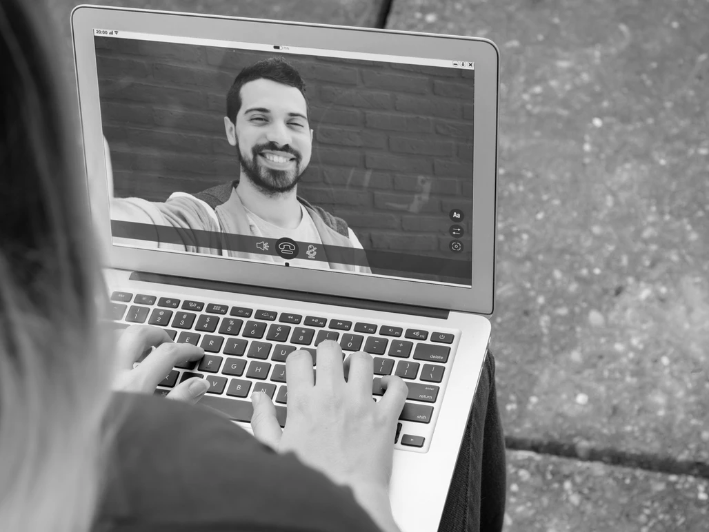 man on video meeting